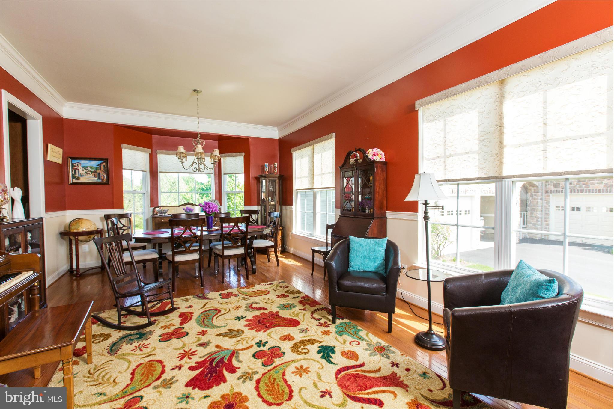 12403 Rochester Park Court Bristow, VA 20136 - Photo 10 of 30 a living room filled with furniture and a large window