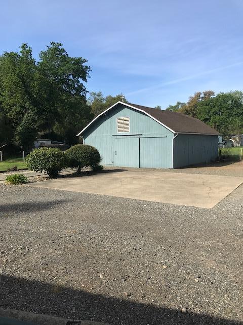 5730 Cedars Road Redding, CA 96001 - Photo 11 of 14 a house with trees in the background