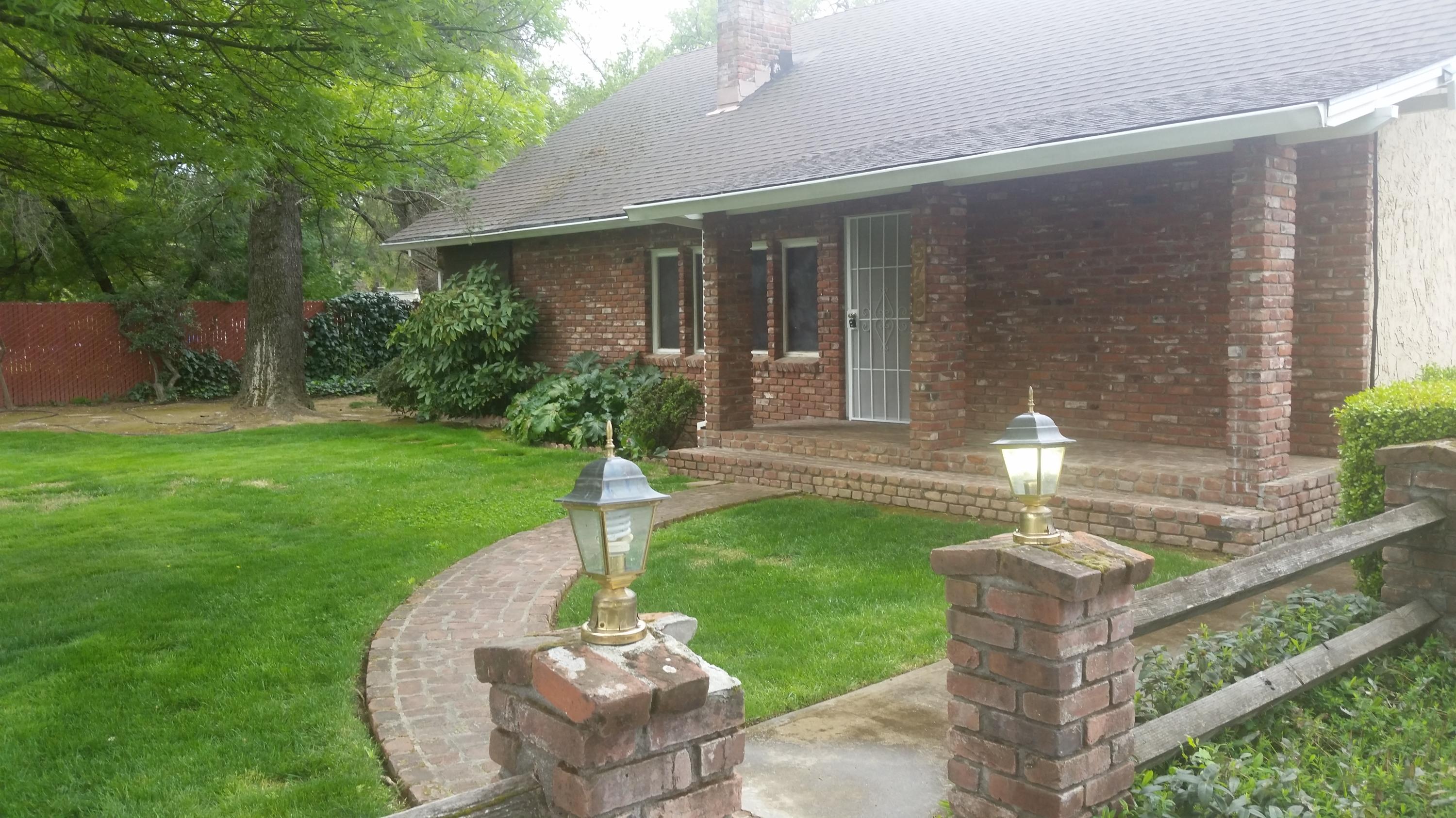 5730 Cedars Road Redding, CA 96001 - Photo 3 of 14 a front view of a house with garden
