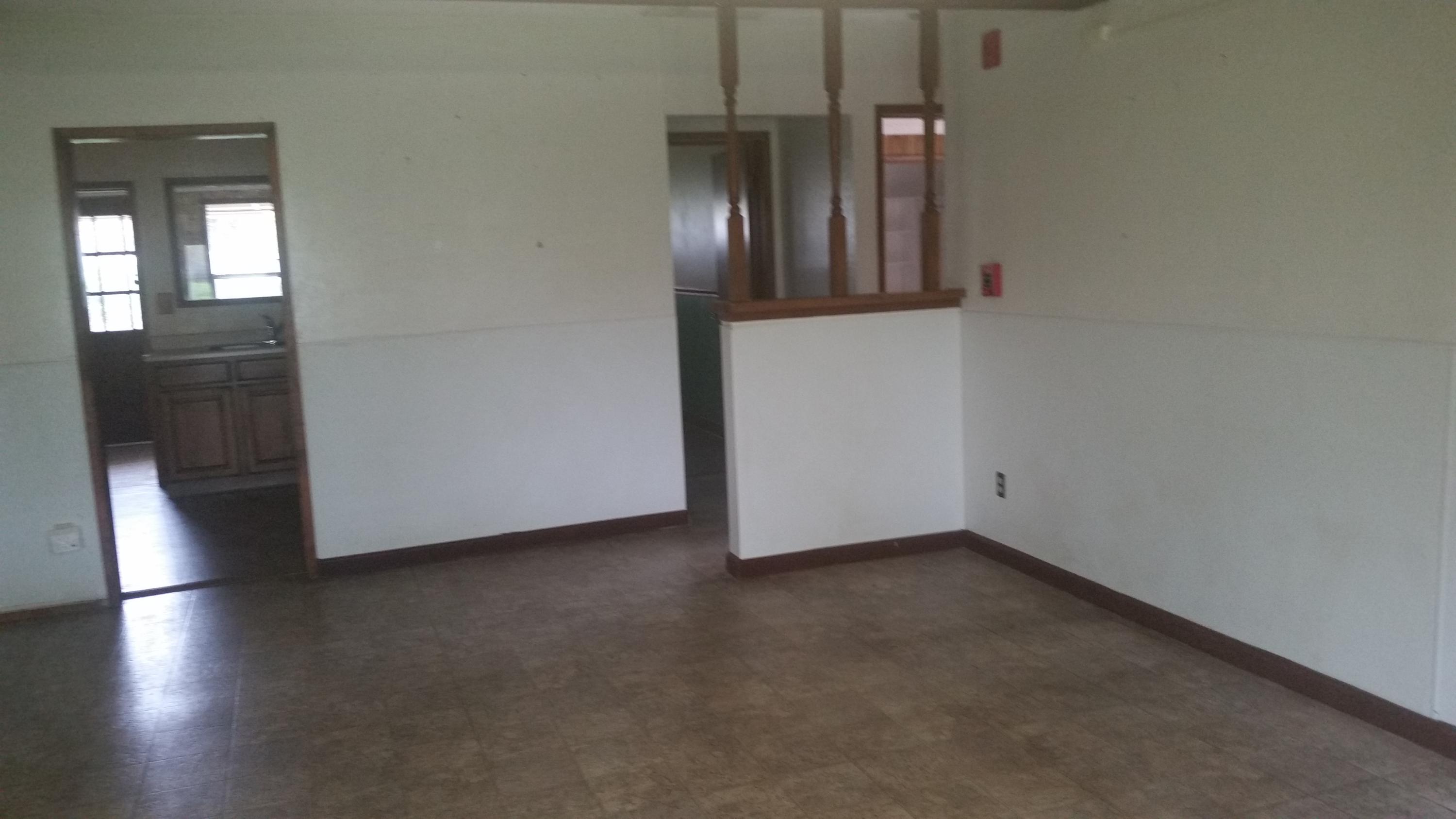 5730 Cedars Road Redding, CA 96001 - Photo 10 of 14 an empty room with wooden floor and windows