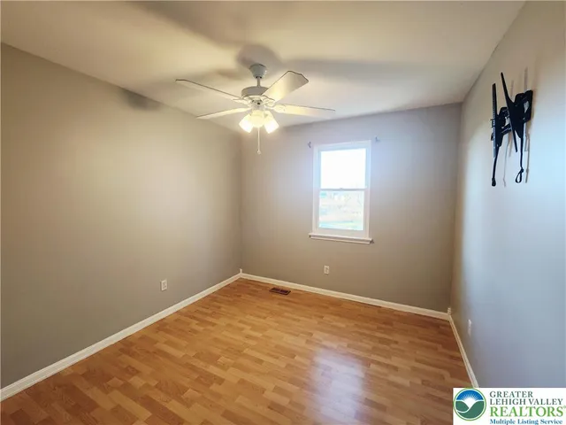 a view of kitchen and refrigerator