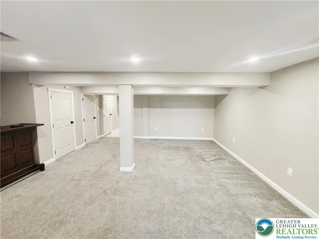 a view of an empty room with a fireplace