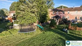 a front view of a house with iron fence