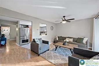 a living room with furniture and a window