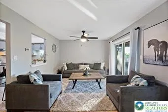 a living room with furniture and a rug