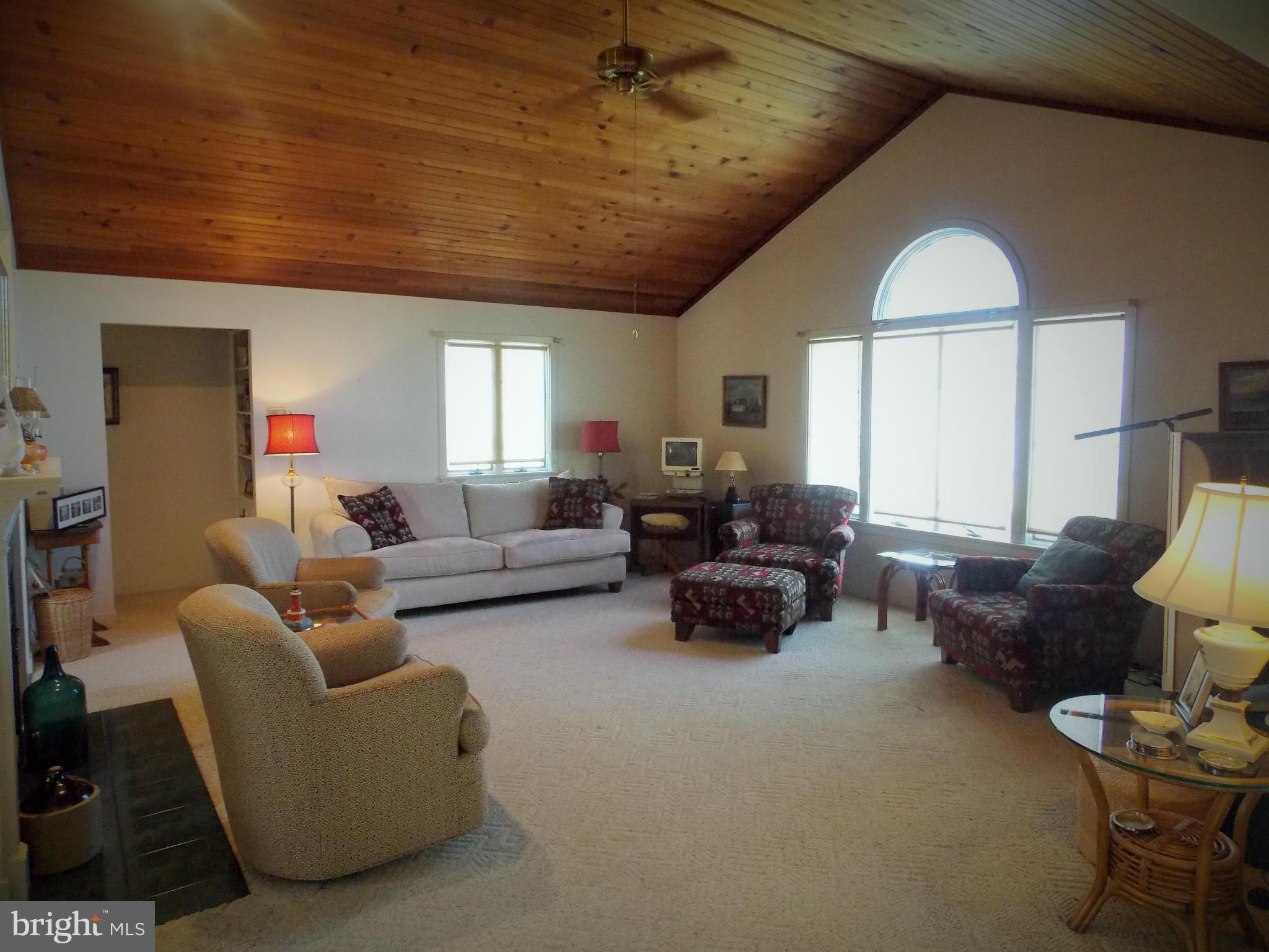 910 Long Point Road Grasonville, MD 21638 - Photo 7 of 29 Living Room with Cathedral Cedar Ceiling