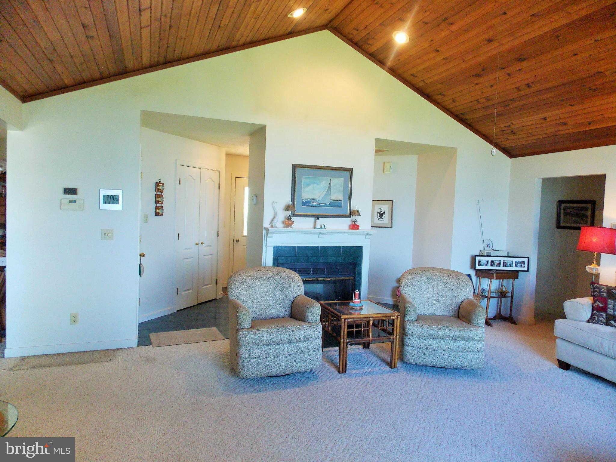 910 Long Point Road Grasonville, MD 21638 - Photo 9 of 29 Living Room Entrance and Fireplace