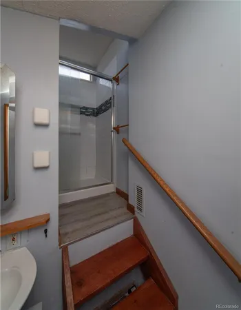 a bathroom with a sink and shower