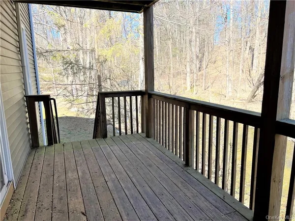 a view of outdoor space with wooden floor and furniture