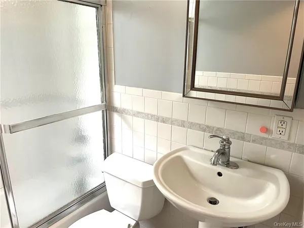 a bathroom with a sink and a large mirror