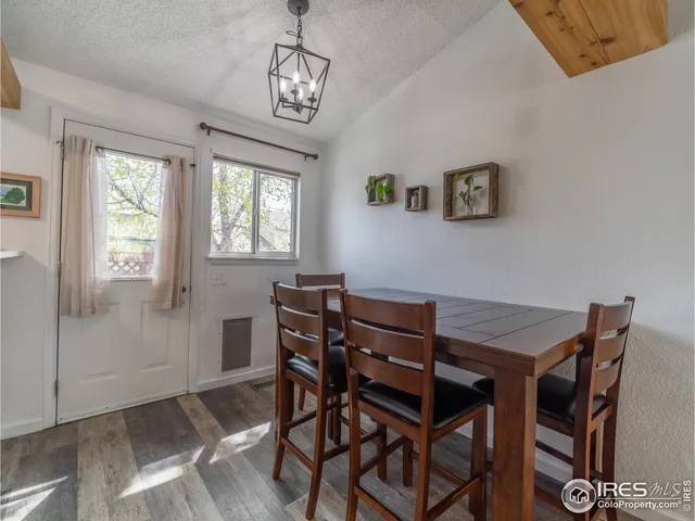 a view of a dining room with furniture and window