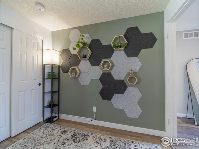 a bedroom with a bed and a lamp