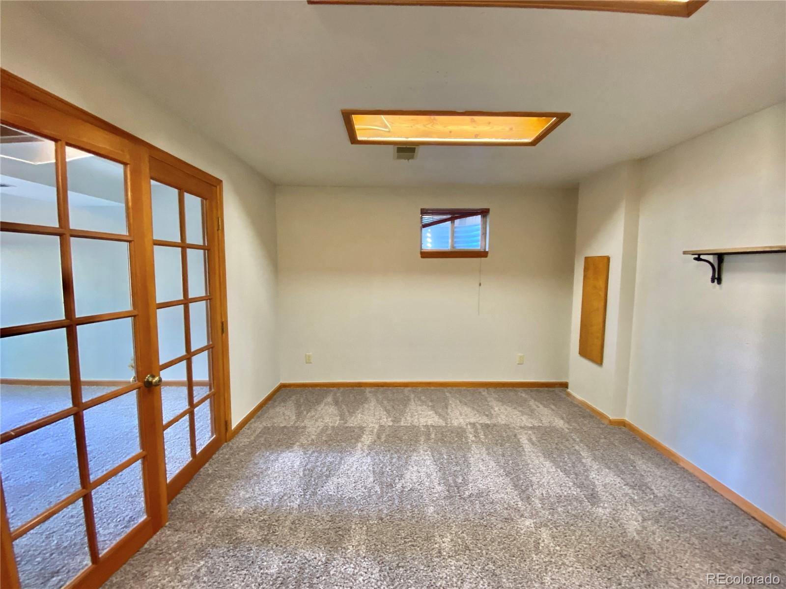 9393 Princeton Street Highlands Ranch, CO 80130 - Photo 11 of 18 an empty room with windows