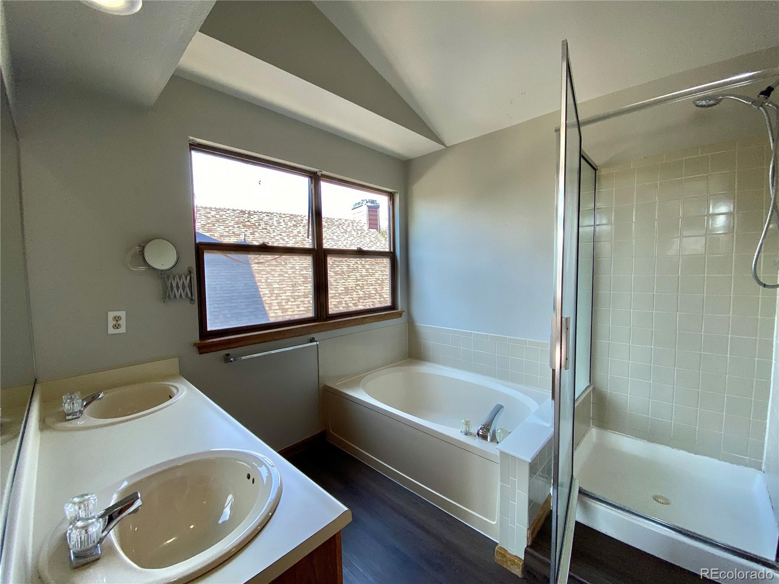 9393 Princeton Street Highlands Ranch, CO 80130 - Photo 12 of 18 a bathroom with a sink a bathtub and a toilet