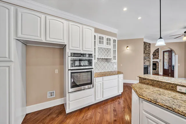 a view of a patio with table and chairs and wooden floor