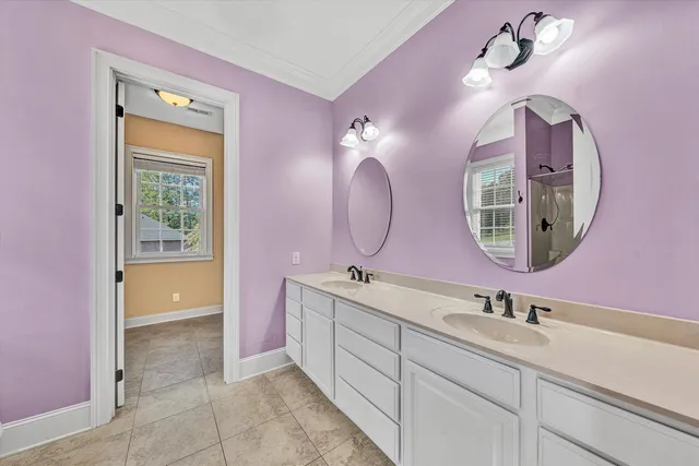 a kitchen with stainless steel appliances granite countertop a refrigerator a stove top oven a sink dishwasher and a dining table with wooden floor