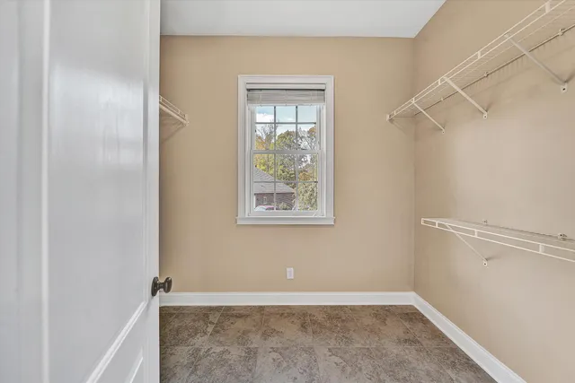 a large kitchen with stainless steel appliances granite countertop a stove and refrigerator