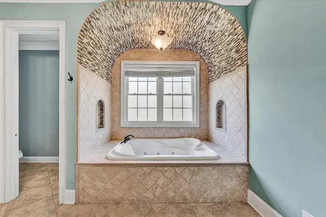 a view of room with wooden floor and natural light