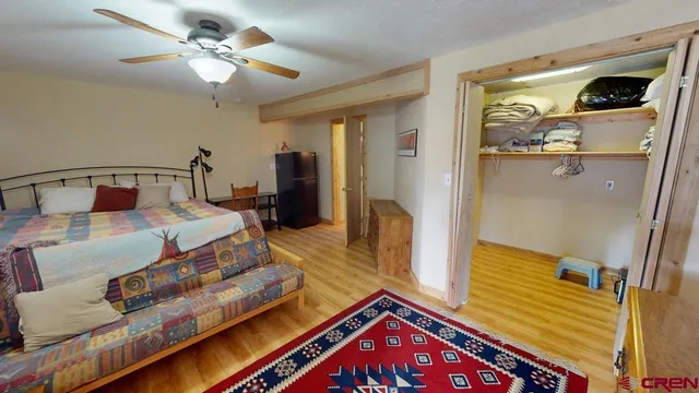 a bedroom with a bed and a table in it