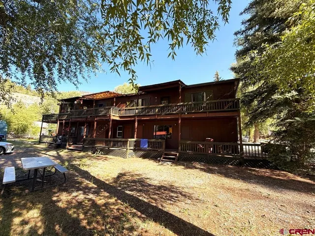 a view of a house with snow on the road