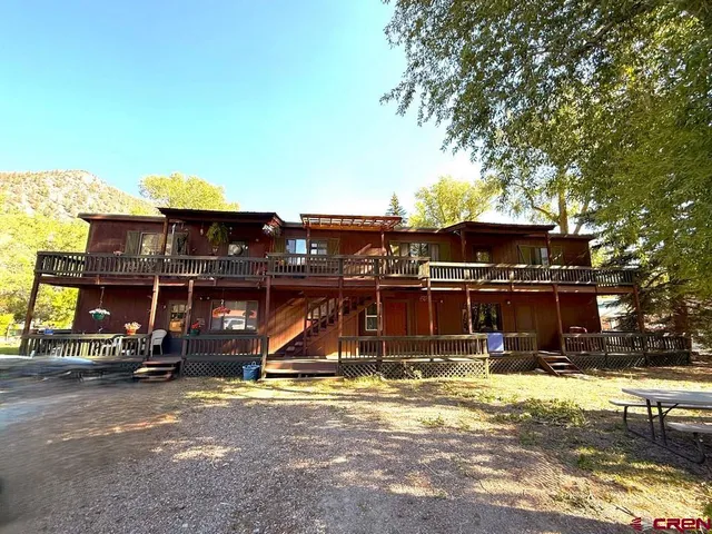 a view of a water fountain in front of the house