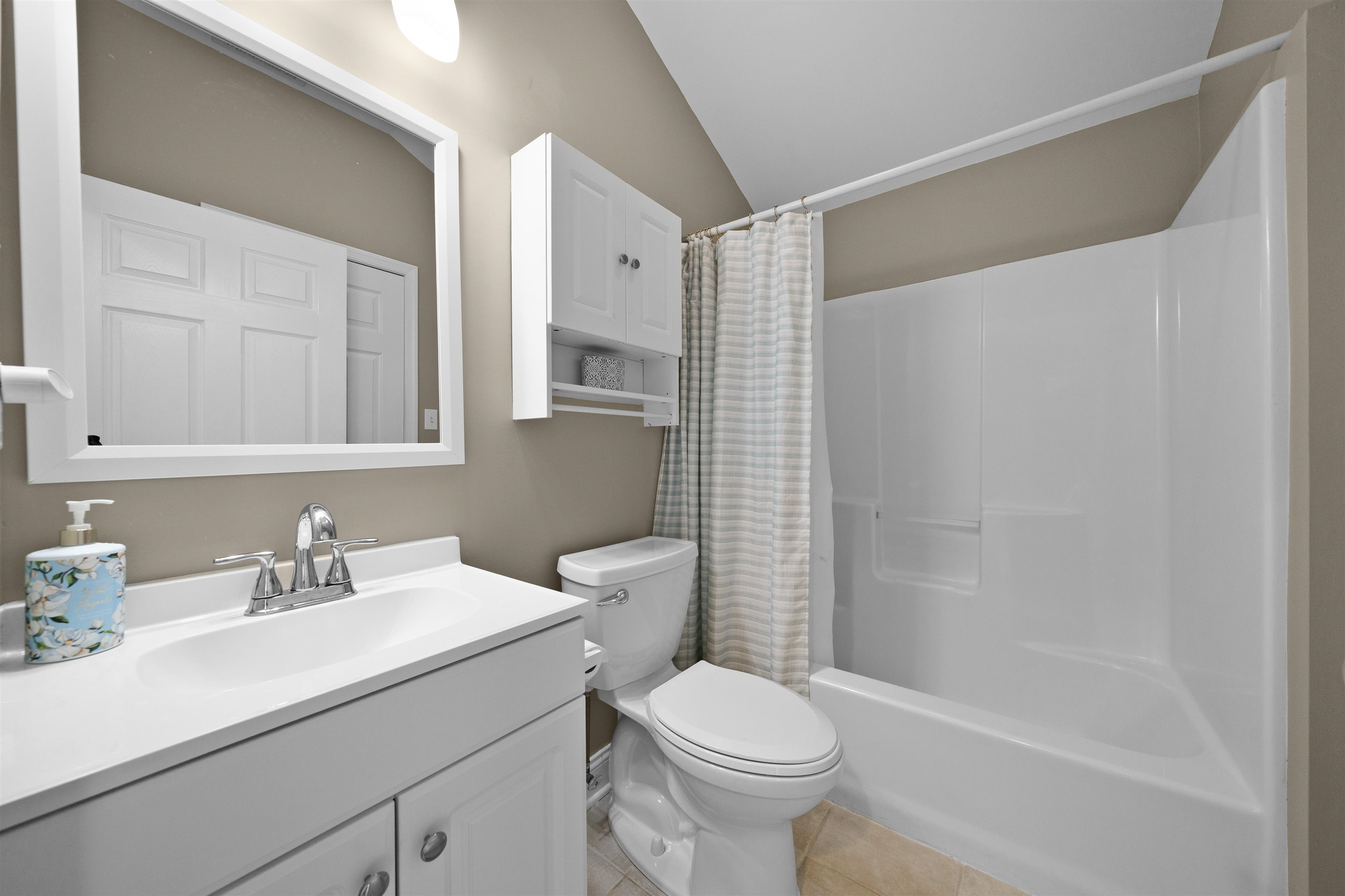 212 25th Street, Unit END Avalon, NJ 08202 - Photo 13 of 34 a bathroom with a sink toilet and shower