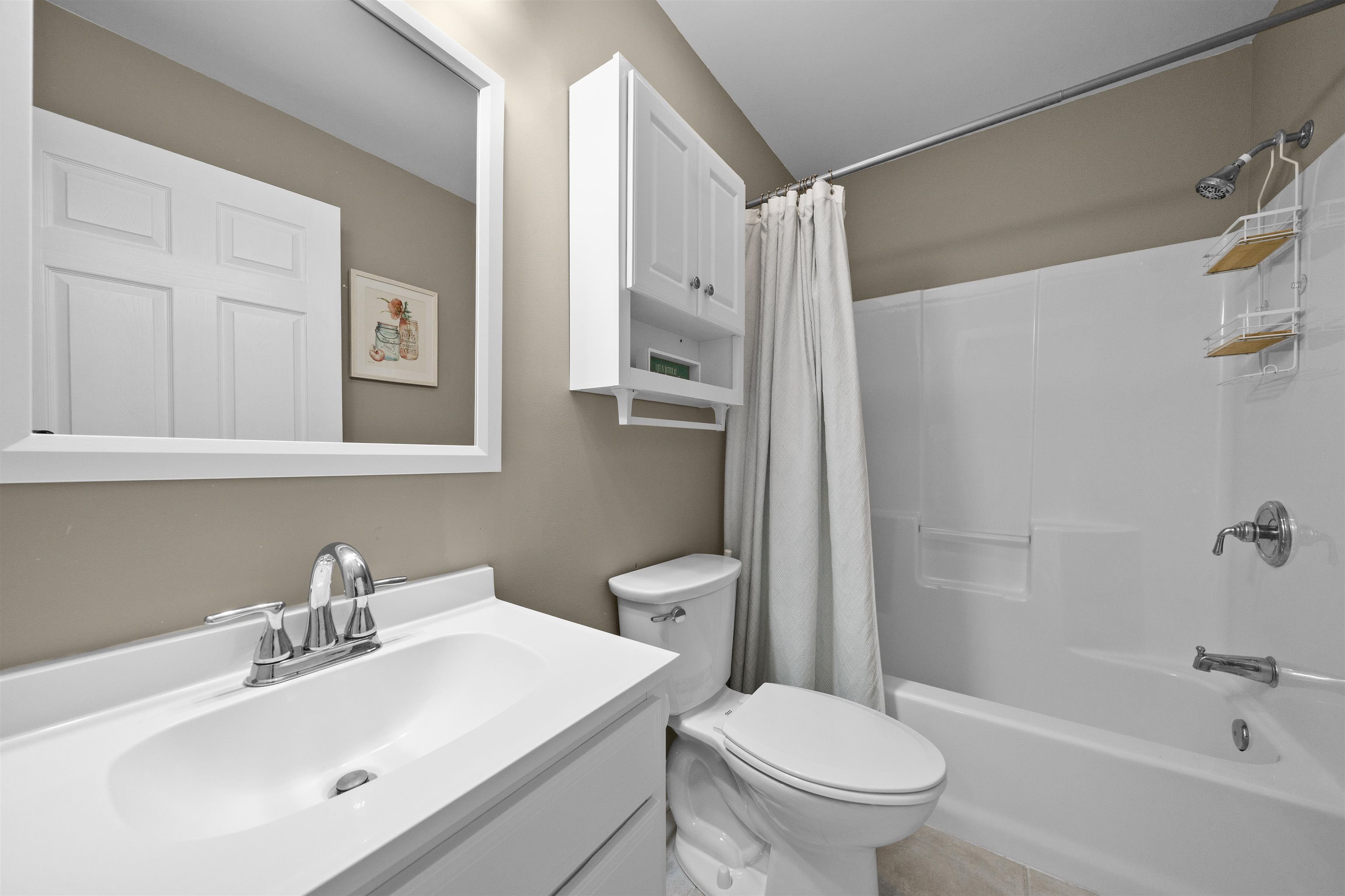 212 25th Street, Unit END Avalon, NJ 08202 - Photo 16 of 34 a bathroom with a sink toilet and shower