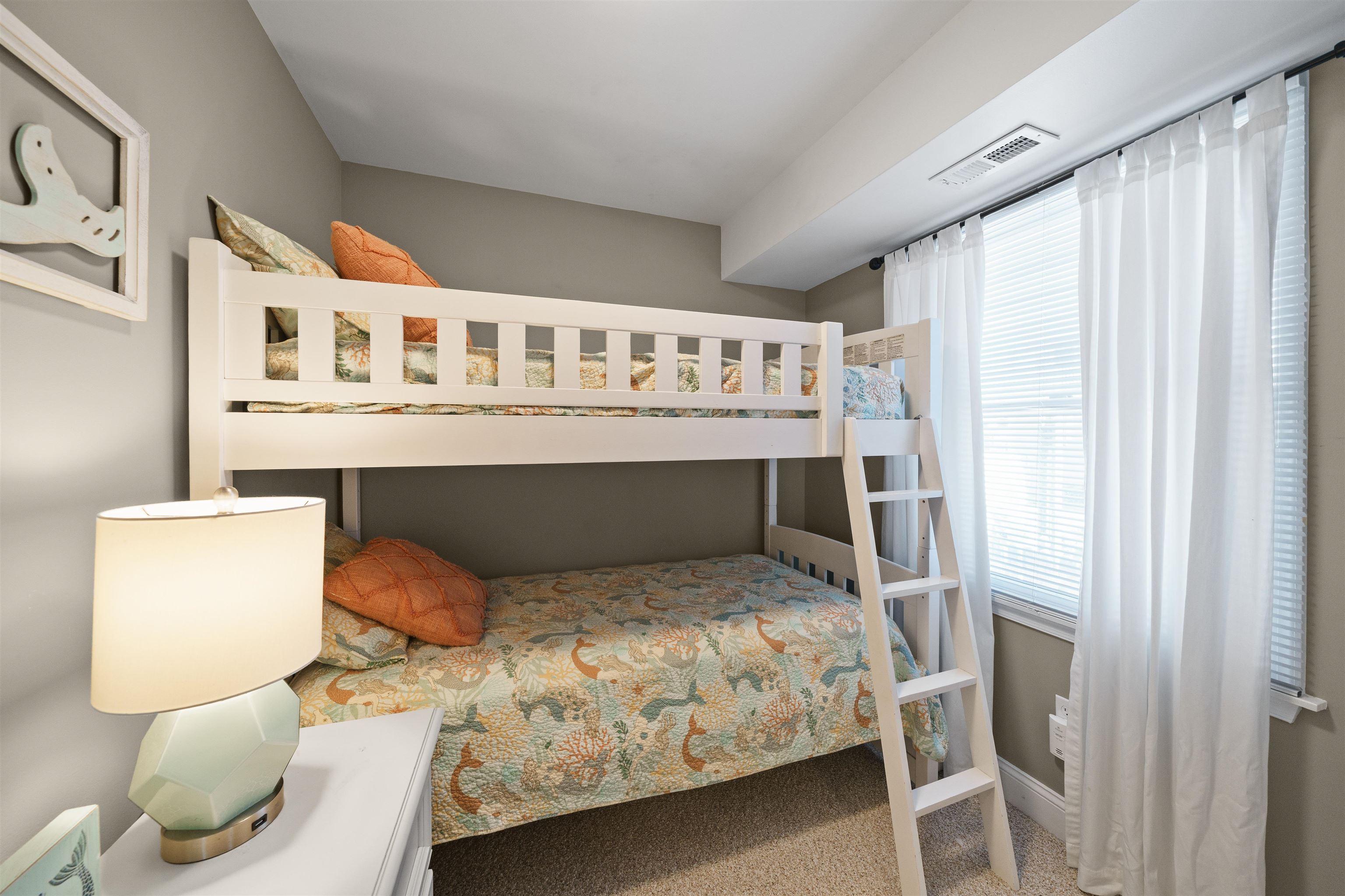212 25th Street, Unit END Avalon, NJ 08202 - Photo 19 of 34 a bedroom with a bed and a table in it