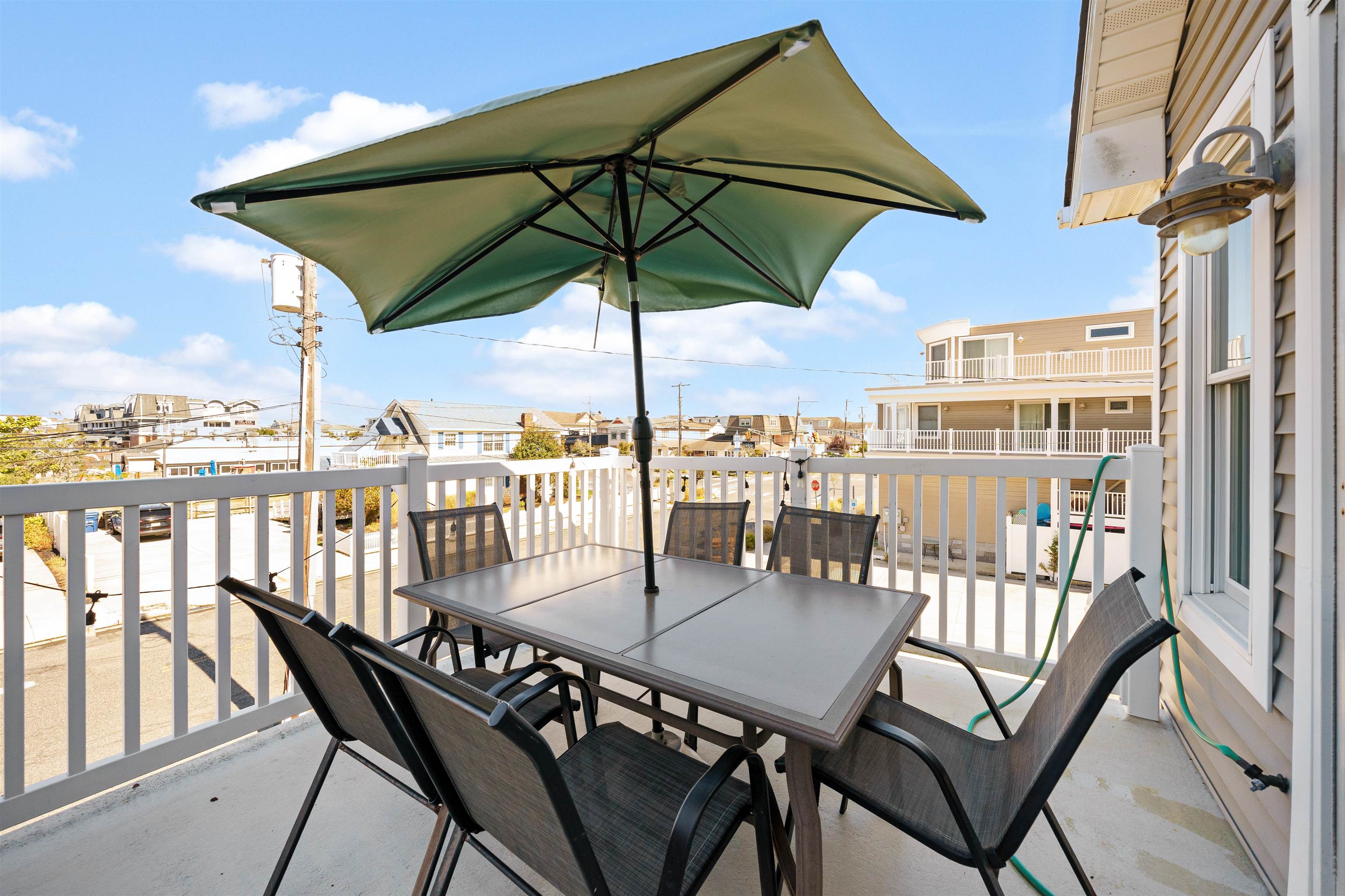 212 25th Street, Unit END Avalon, NJ 08202 - Photo 20 of 34 a view of a balcony with an outdoor seating