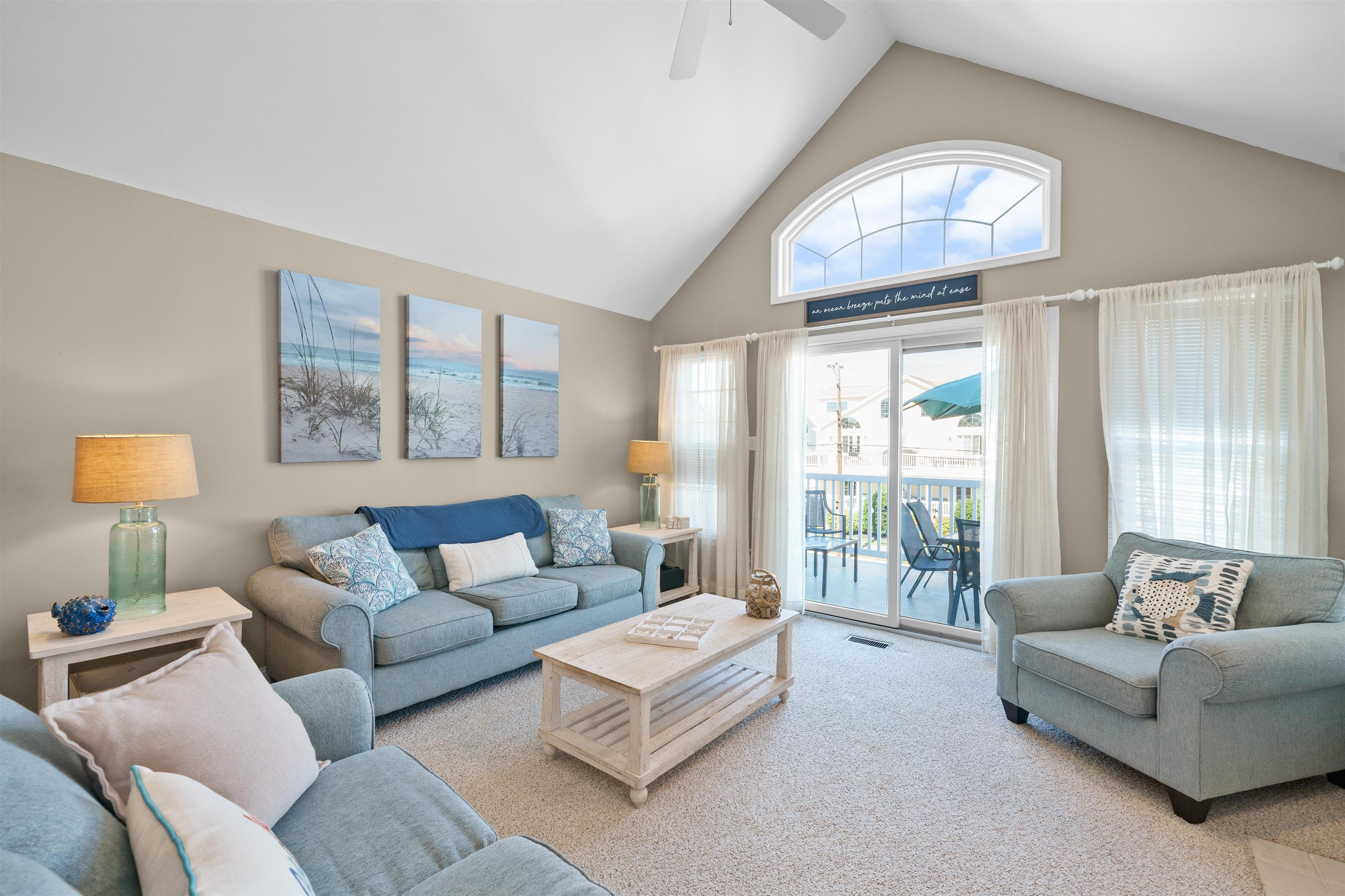 212 25th Street, Unit END Avalon, NJ 08202 - Photo 3 of 34 a living room with furniture and a large window
