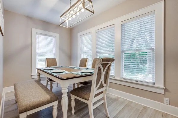 a view of a dining room with furniture and window