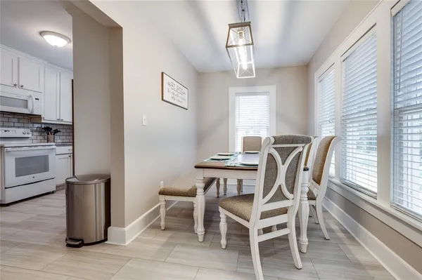 a bathroom with a sink a toilet and shower curtain