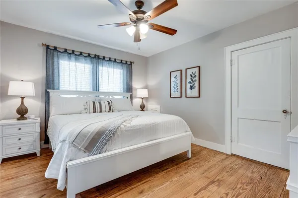 a bedroom with a bed and window