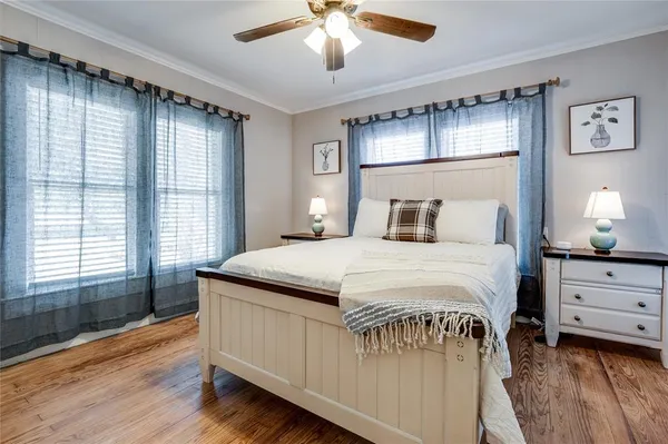 a view of a bedroom with furniture and chandelier