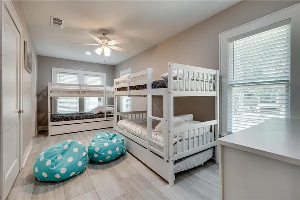 a living room with a bed furniture and a window