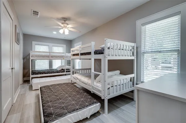 a bedroom with furniture and a window