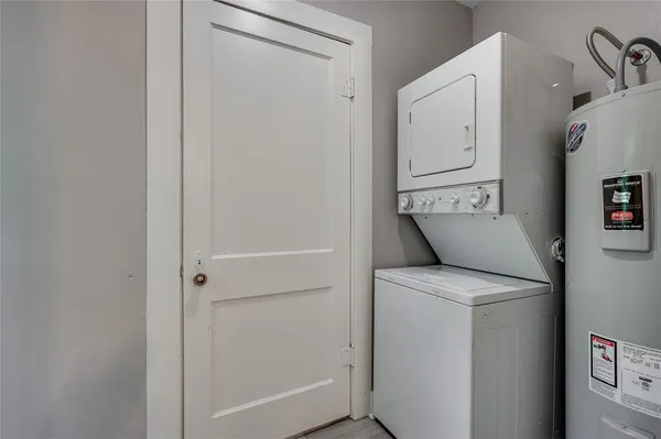 a view of a chairs and table in backyard of the house
