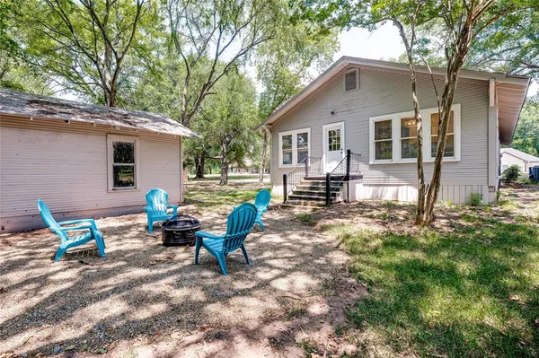 a view of a park with sitting area