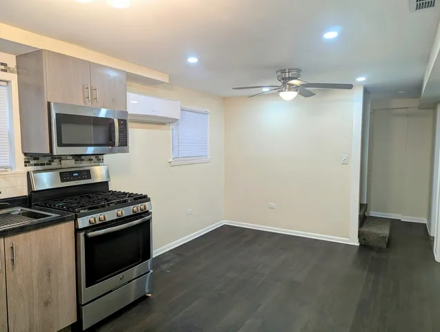 a kitchen with a stove and a microwave