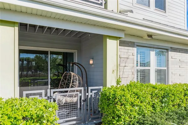 a view of a chair and table in the porch