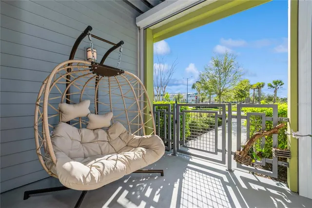 a view of a balcony with furniture