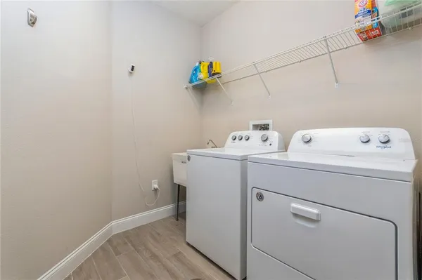 a utility room with dryer and washer