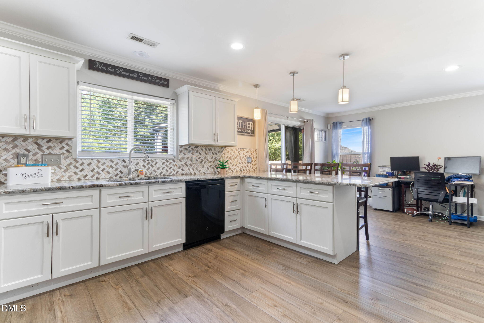 3713 Marshlane Way Raleigh, NC 27610 - Photo 11 of 38 a kitchen with granite countertop a sink cabinets and wooden floor
