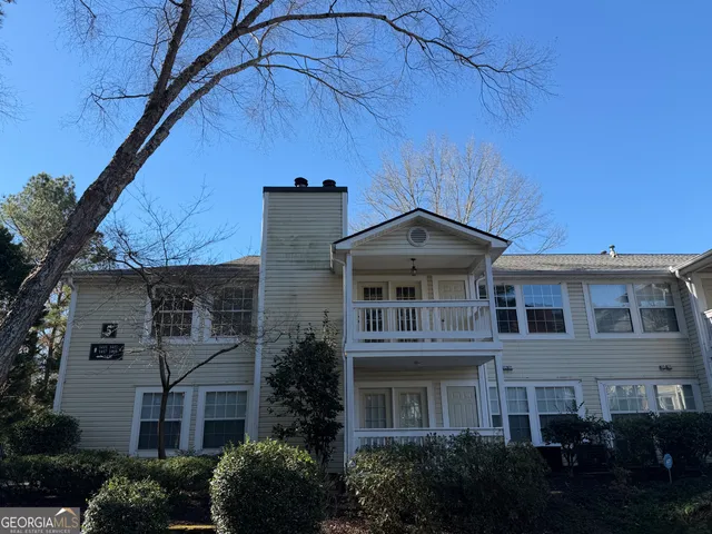 a view of a building with a yard