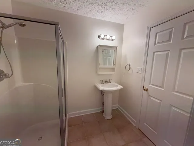 a bathroom with a sink toilet