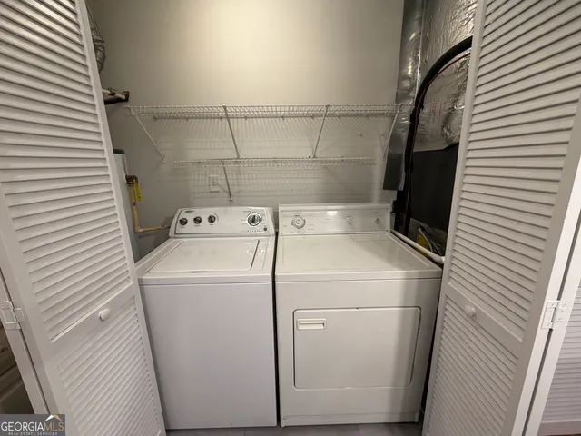a utility room with dryer and washer