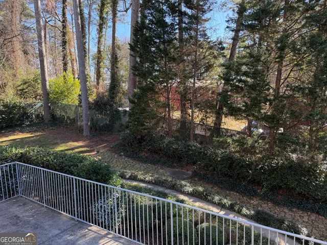 a view of balcony and yard