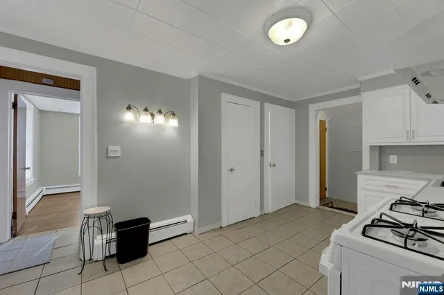 a kitchen that has a sink and a stove in it