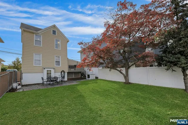 a front view of house with yard and seating area