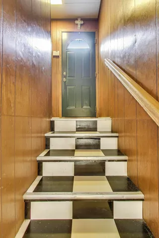 a view of staircase with white walls